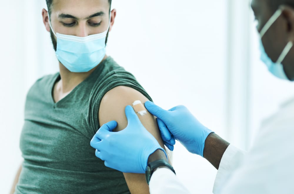 A resident of British Columbia receiving the COVID-19 Vaccine