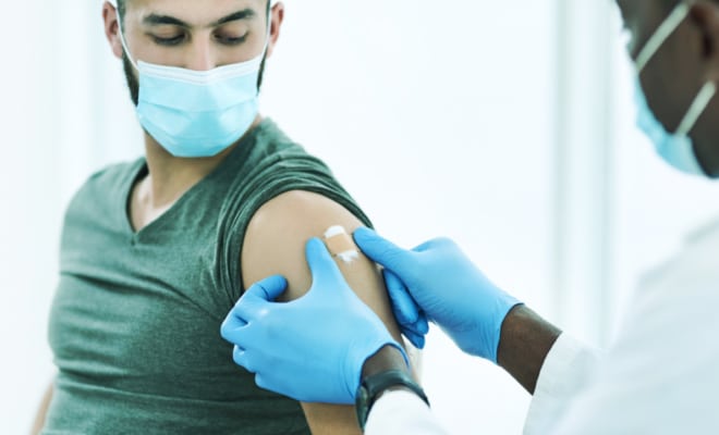 A resident of British Columbia receiving the COVID-19 Vaccine