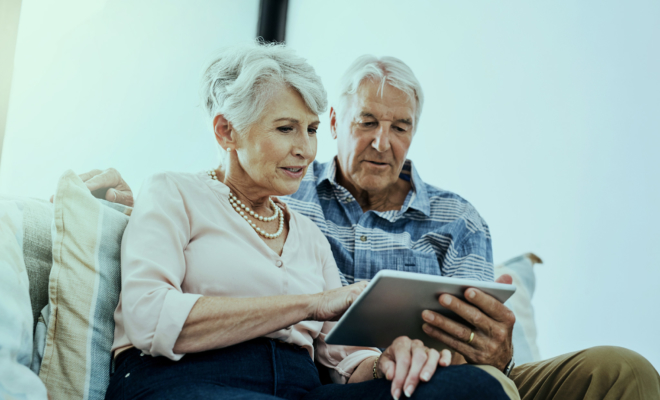 senior couple using a digital tablet